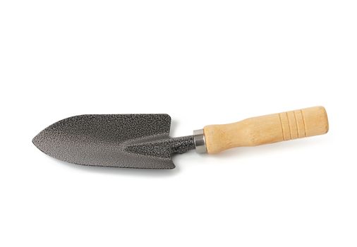 new metal garden trowel on wooden handle isolated on white background, close up