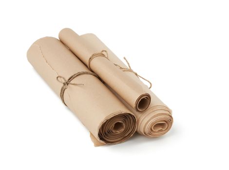 stack of twisted rolls of brown paper isolated on white background, close up, paper tied with a rope