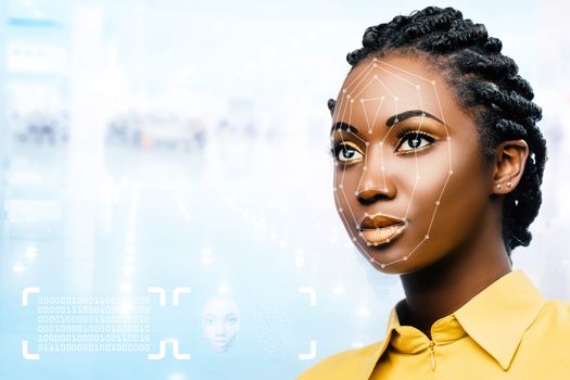 Close up portrait of attractive young african woman showing conceptual face recognition safety scan.