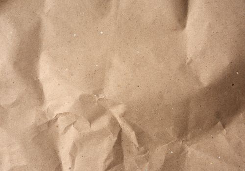 crumpled blank sheet of brown wrapping kraft paper, vintage texture for the designer, full frame