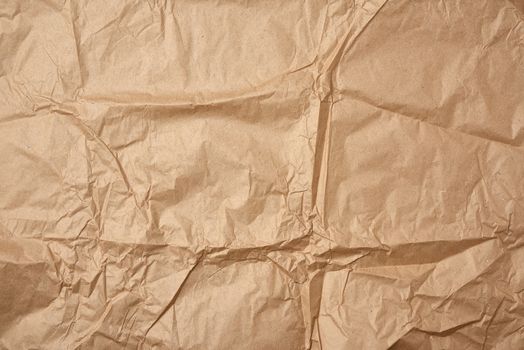 crumpled blank sheet of brown wrapping kraft paper, vintage texture for the designer, full frame
