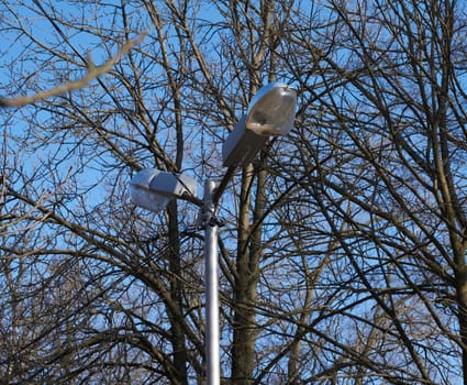 street glass electric lamp in the middle of the park, day