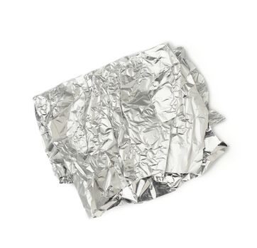 frosted crumpled piece of foil isolated on white background, packaging material for food and objects