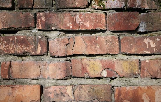 red brick old wall with cement, fragment of architecture, close up