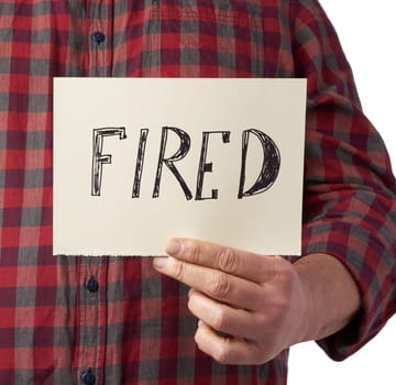 man in a plaid shirt holds a piece of paper with the inscription fired, unemployment concept against the backdrop of the global crisis, fired employee, man on a white background