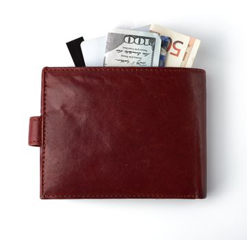 European Union paper money Euro and US dollars in a brown leather wallet on a white background, concept of wealth, exchange investment, crisis