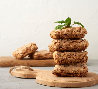 baked Krakow meringue cookies on a wooden board, delicious dessert of whipped egg whites and almond flour