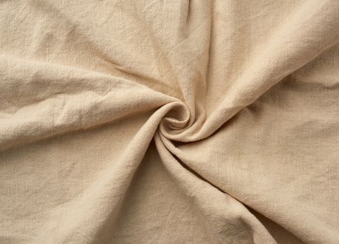 twisted beige kitchen cotton napkin, full frame, close up