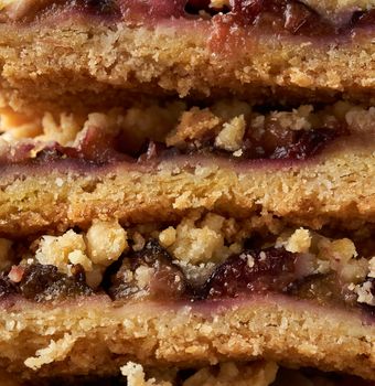texture of baked plum crumble cake, full frame, close up