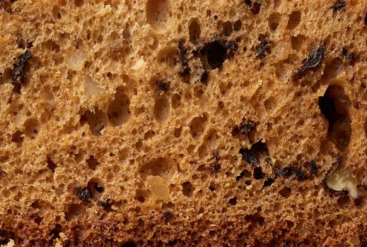brown texture of baked sponge cake with nuts, baking structure, full frame