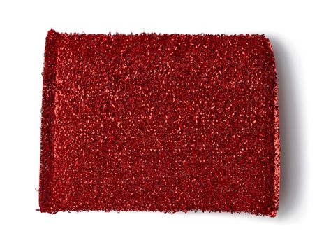 red shiny sponge isolated on white background, close up