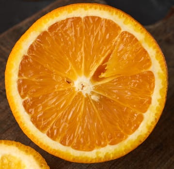 half ripe juicy orange, top view, close up