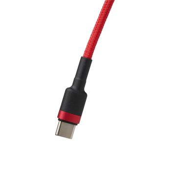 cable type c in red braid isolated on a white background, device for charging mobile gadgets