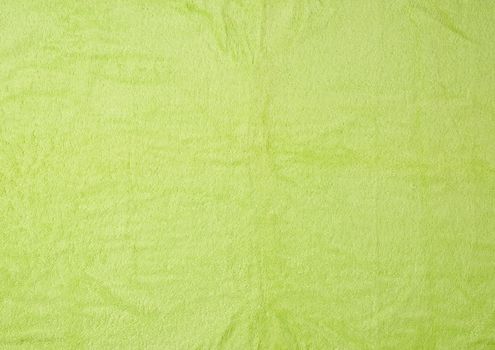 texture of fleecy bright green towels, full frame, close up