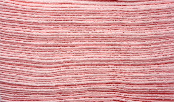 texture of pink paper napkins, full frame, close up