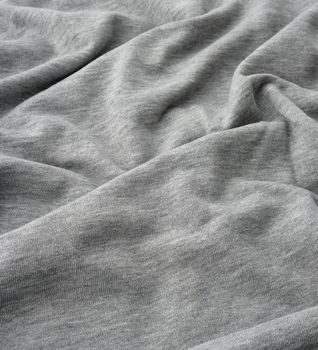 gray cotton stretch fabric for sewing clothes, canvas with waves, close up