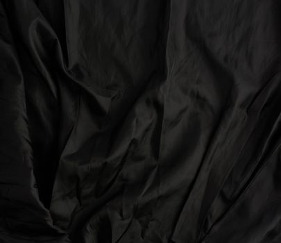 texture of black cotton fabric with waves, full frame, fabric for sewing clothes, shirts. Design Element