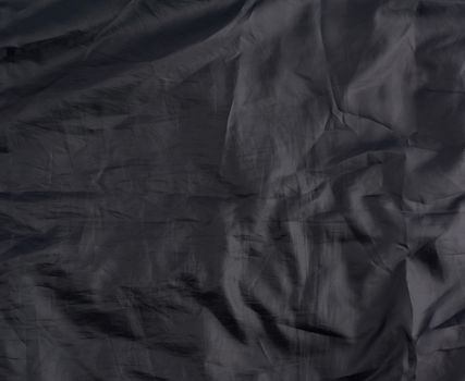 crumpled gray synthetic fabric for the manufacture of lining for skirts, full frame