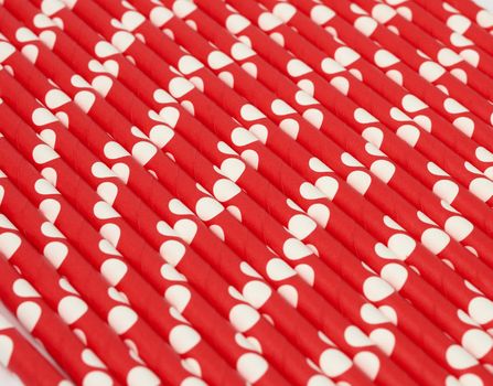red paper cocktails with white polka dots, close up