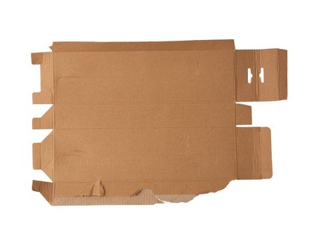 torn and unfolded cardboard box isolated on a white background, close up