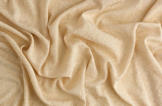 beige satin textile fabric with embroidery elements, piece of canvas for sewing curtains and things, full frame. Crumpled textile satin, great design for any purposes.