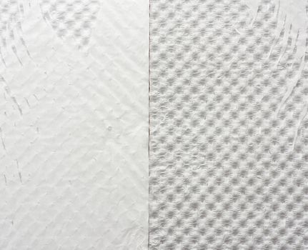 fragment of white tattered wrapping paper, full frame, close up