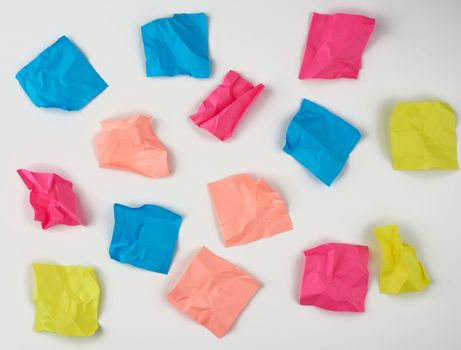 multicolored blank crumpled paper stickers on a white background