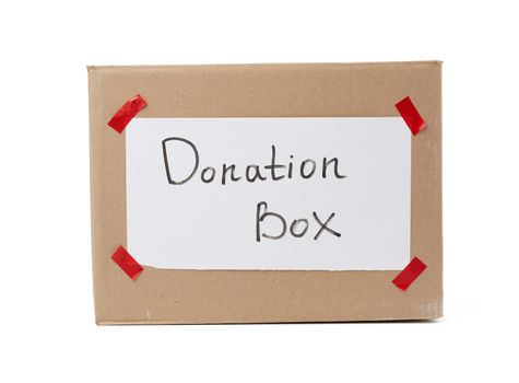 brown cardboard box with a pasted white sheet and the inscription donation box on a white background, help concept