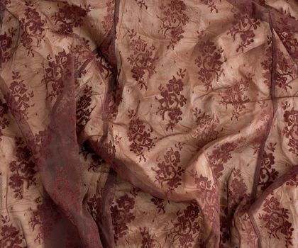 texture of crumpled brown synthetic fabric guipure for sewing clothes, full frame
