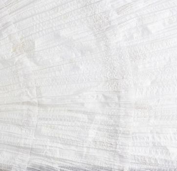 crumpled white cotton fabric, fabric for sewing clothes and shirts, full frame
