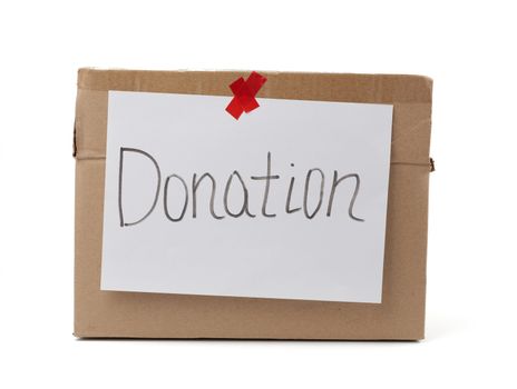 brown cardboard box with a pasted white sheet and the inscription donation on a white background, help concept