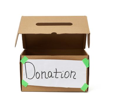 open empty brown cardboard box with a pasted white sheet and the inscription donation on a white background, help concept