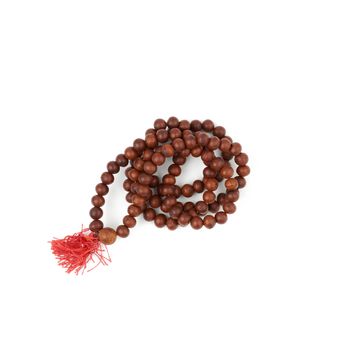 brown wooden prayer rosary isolated on a white background, top view