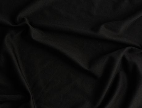 texture of black cotton fabric with waves, full frame, fabric for sewing clothes, shirts. Design Element