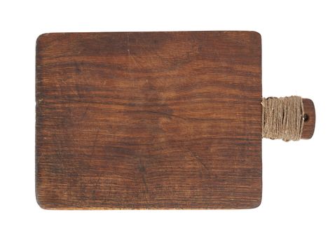 very old brown wooden kitchen cutting board with a rope wrapped in a handle, utensils isolated on a white background