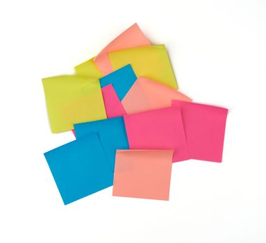 multicolored blank paper stickers of different colors on a white background, copy space