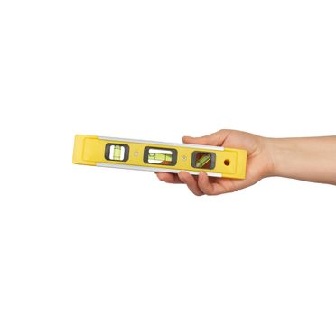 female hand hold plastic yellow level tool with capsules isolated on white background, close up