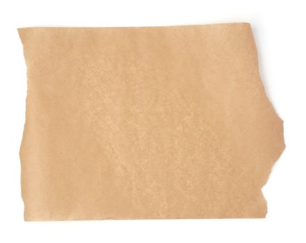 piece of brown parchment paper with torn edges isolated on a white background, place for an inscription, element for a designer