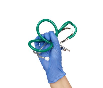 hand holds a medical stethoscope, sterile latex glove is on the hand, white isolated background