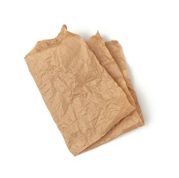 folded piece of crumpled brown paper isolated on white background, element for designer