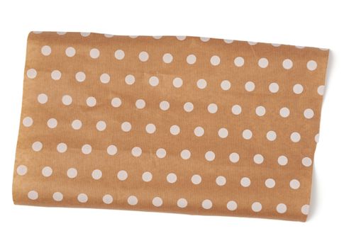 piece of brown paper with white polka dots isolated on a white background, top view