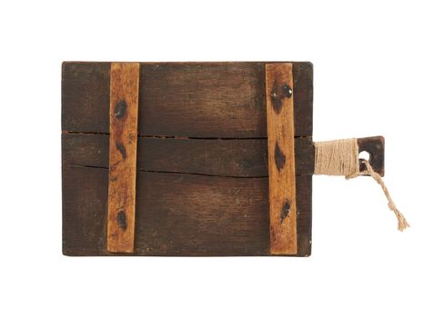 very old brown rectangular wooden kitchen cutting board with handle, utensils isolated on a white background