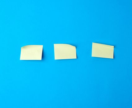yellow paper stickers on a blue background, backdrop for the designer