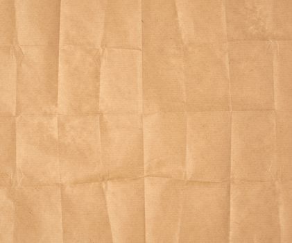crumpled blank sheet of brown wrapping kraft paper, vintage texture for the designer, full frame