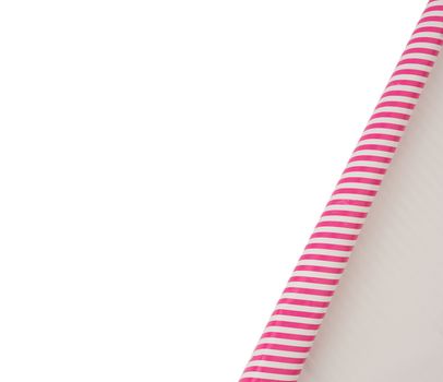 curved edge of a pink paper sheet is isolated on a white background, place for an inscription