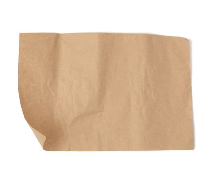 piece of brown parchment paper with torn edges isolated on a white background, place for an inscription, element for a designer