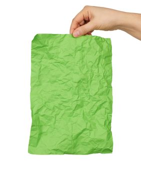 female hand hold empty crumpled green rectangular sheet of paper a4, white background 