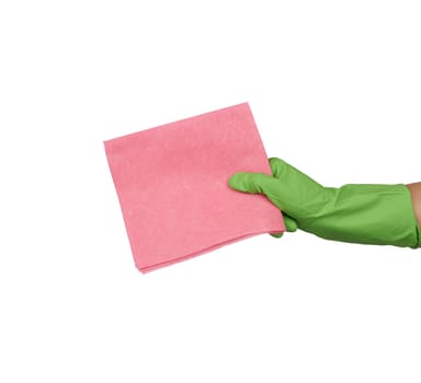 hand holds a pink rag sponge for cleaning, protective green rubber glove is worn on the arm, part of the body is isolated on a white background