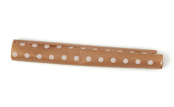 twisted white polka dot brown paper roll isolated on a white background, top view