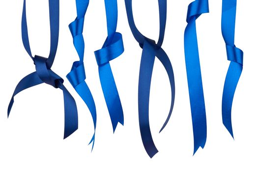 set of twisted blue silk ribbon ends with knots isolated on white background, trendy colors of elements for designer